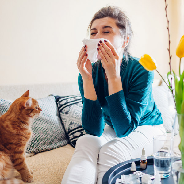 woman blowing her nose