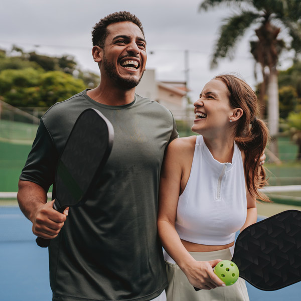 young couple playing pickleball