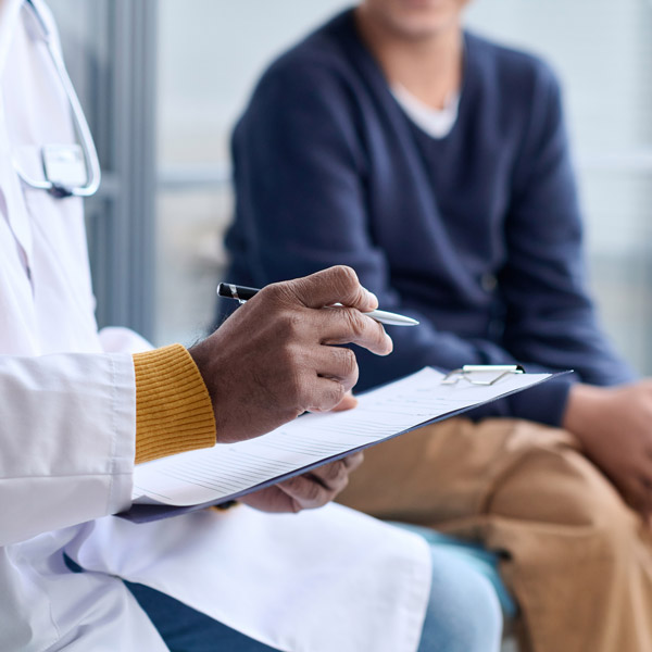 doctor filling out paperwork