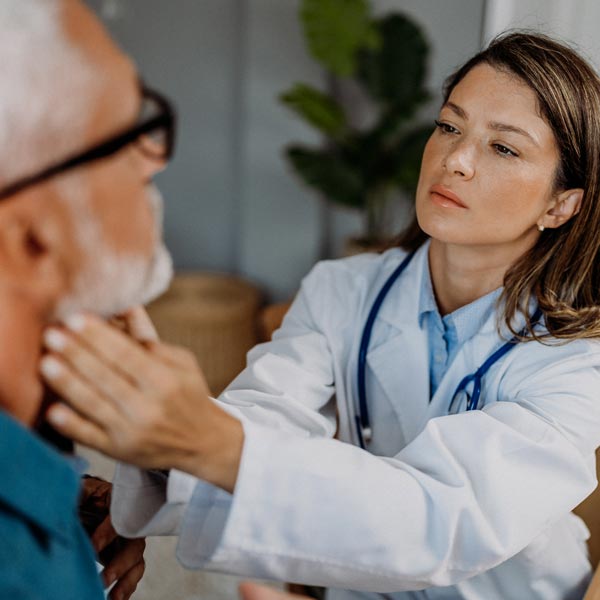 doctor examining patient's throat