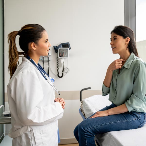 doctor talking to patient in office